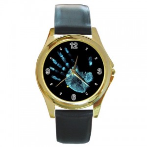 http://www.starsonstuff.com/5503-thickbox/the-fringe-glyph-gold-tone-metal-watch.jpg